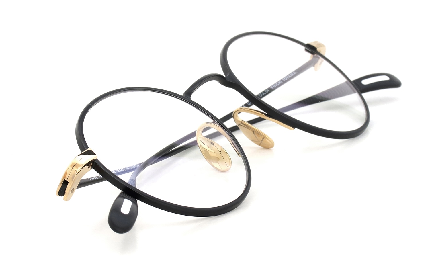 YUICHI TOYAMA. メガネ通販 U-186 Lemer col.04 Matt black / White gold 折りたたみ斜め 1